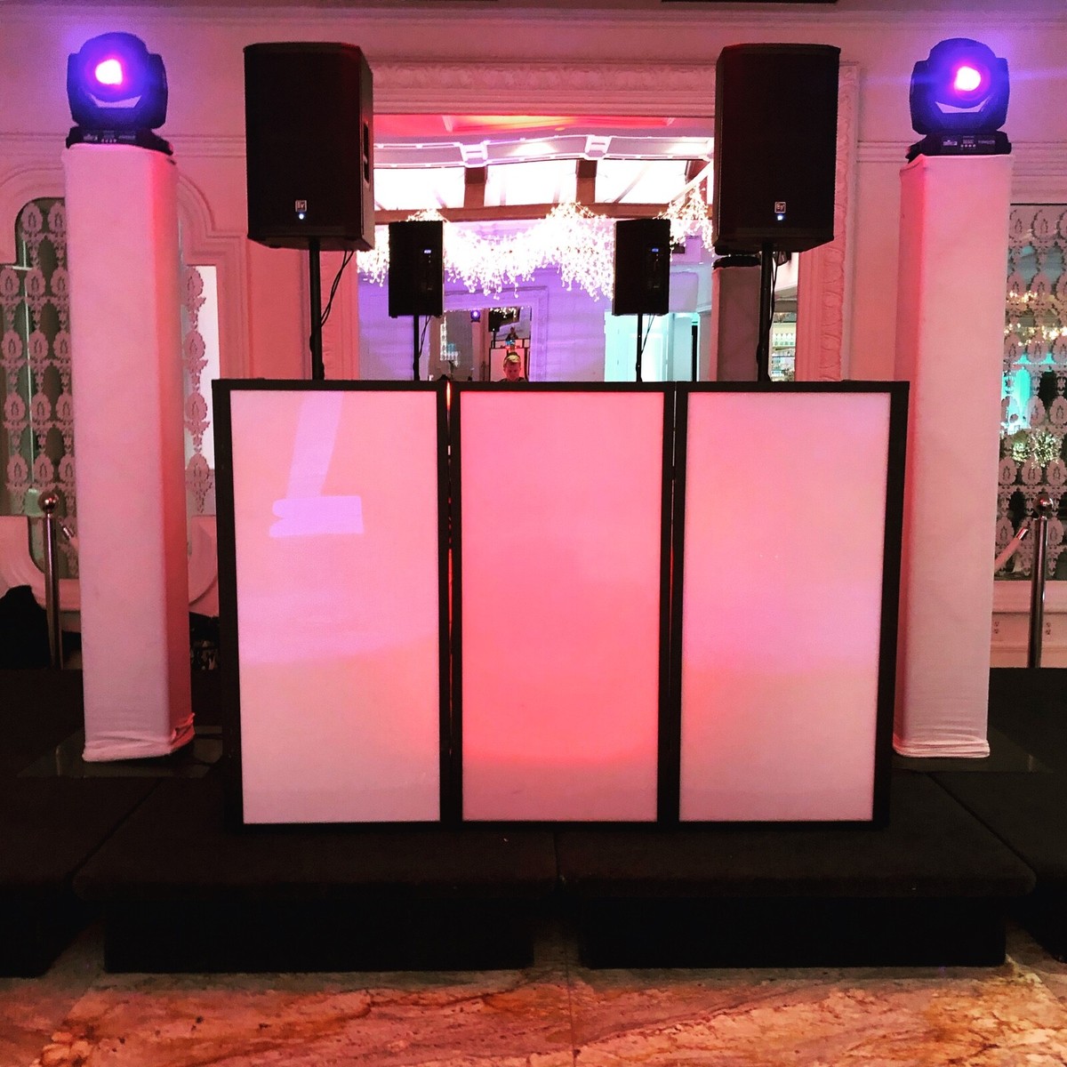 Wedding DJ setup with moving heads and EV speakers